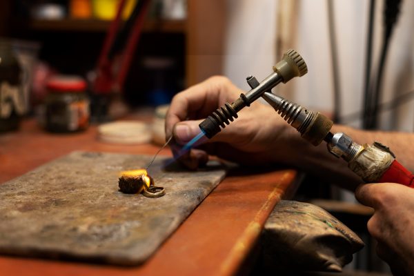 jewelry-maker-working-alone-atelier